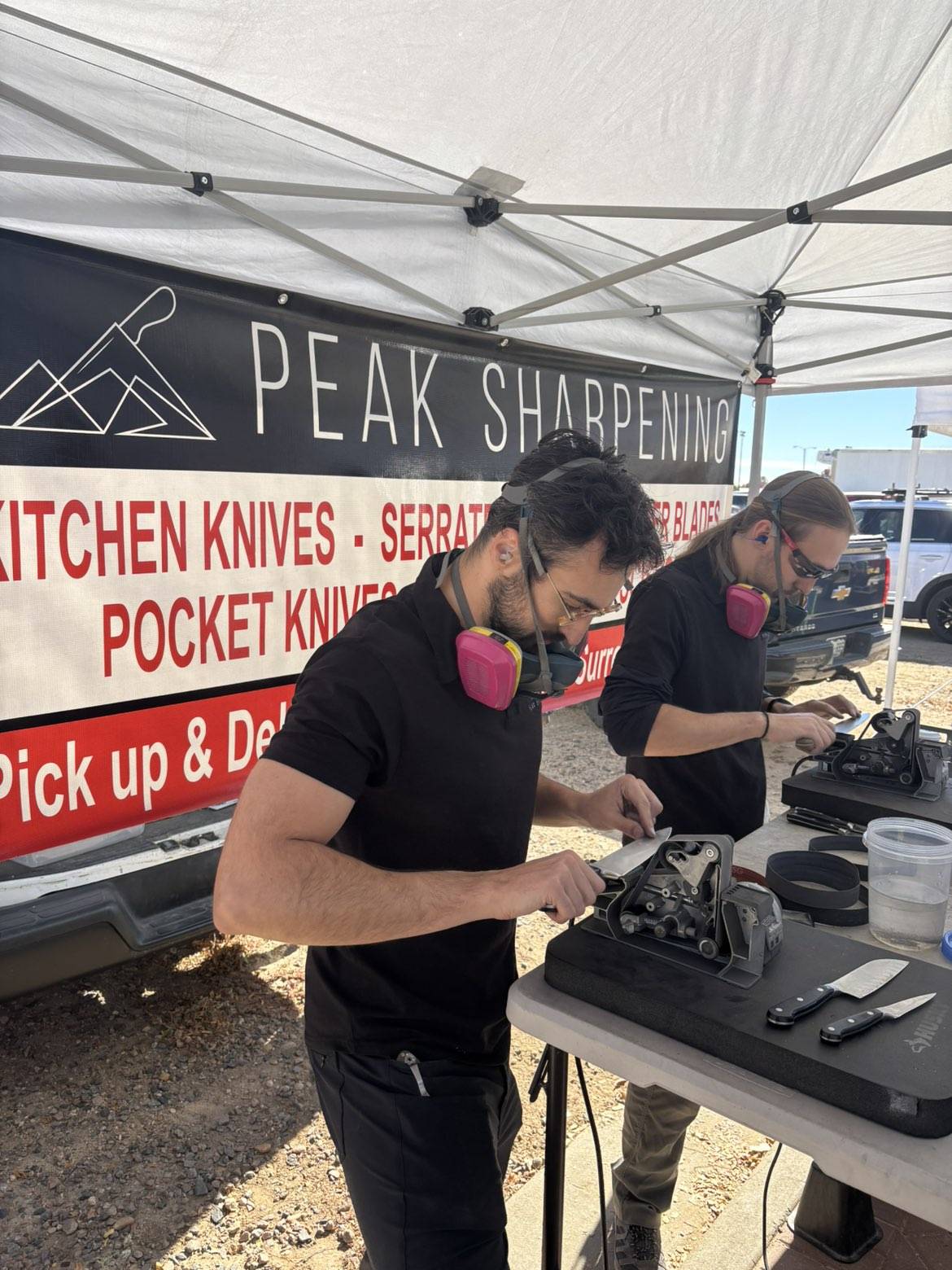Peak Sharpening serving customers at a local market